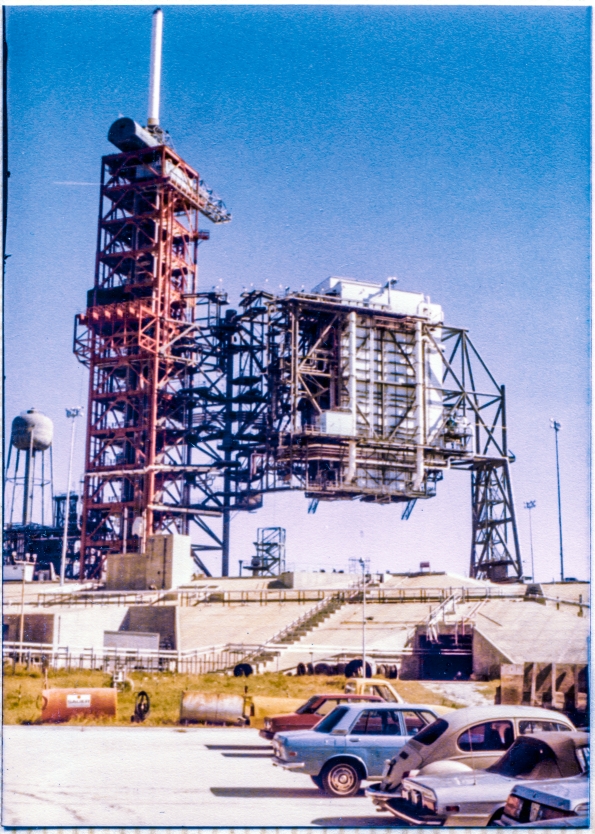 Image 050. The Rotating Service Structure at Space Shuttle Launch Complex 39-B, Kennedy Space Center, Florida, begins to swing grandly back around to the demate position it was constructed in by Union Ironworkers from Local 808 working for Wilhoit Steel Erectors, following its initial rotational proof-test in which it was swung through 120 degrees of end-to-end travel, for the first time ever, into its mate position, spanning the Flame Trench. Photograph by James MacLaren. Image 050. The Rotating Service Structure at Space Shuttle Launch Complex 39-B, Kennedy Space Center, Florida, begins to swing grandly back around to the demate position it was constructed in by Union Ironworkers from Local 808 working for Wilhoit Steel Erectors, following its initial rotational proof-test in which it was swung through 120 degrees of end-to-end travel, for the first time ever, into its mate position, spanning the Flame Trench. Photograph by James MacLaren.